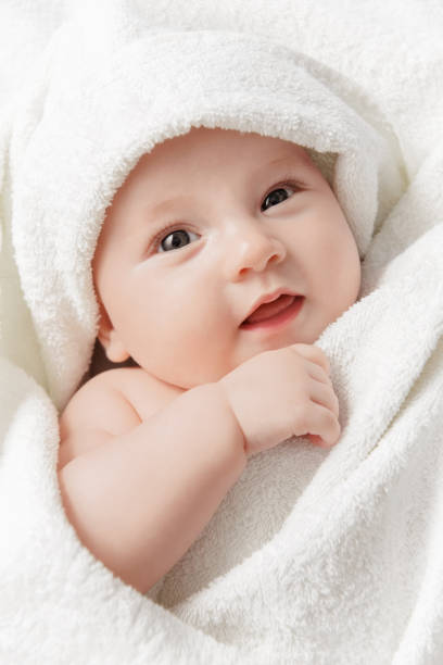 istock Smiling baby in a towel 1187193369