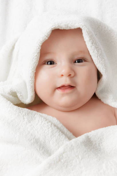 istock Smiling baby in a towel 1187194507