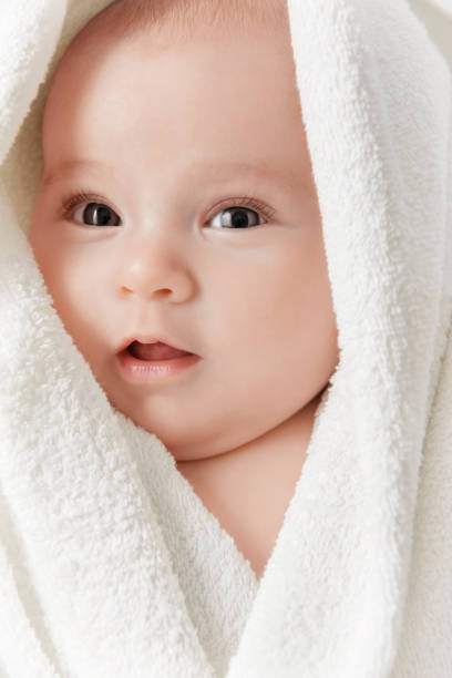istock Smiling baby in a towel 1187194594