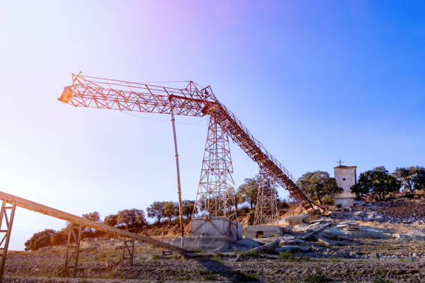 istock Big crane in the countryside with a blue sky 1187198868
