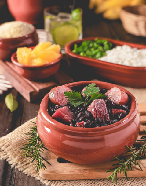 Feijoada (bean stew) - Brazilian Traditional Food (Dry Beef, Cabbage, Orange, Rice, Beans) stock photo