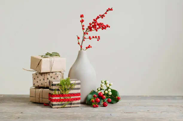 Photo of Eco friendly Christmas decorated craft paper gift boxes with branches