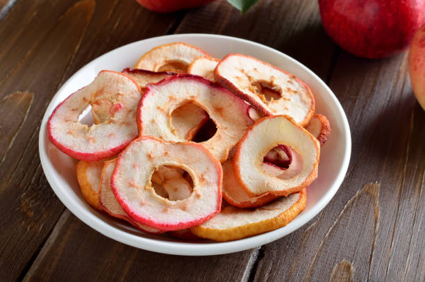 istock Dried apple rings in white bowl 1187204216