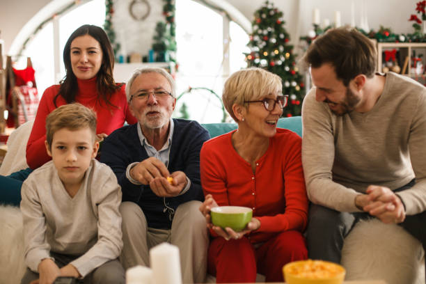 istock Family bonding and watching TV on Christmas 1187204607