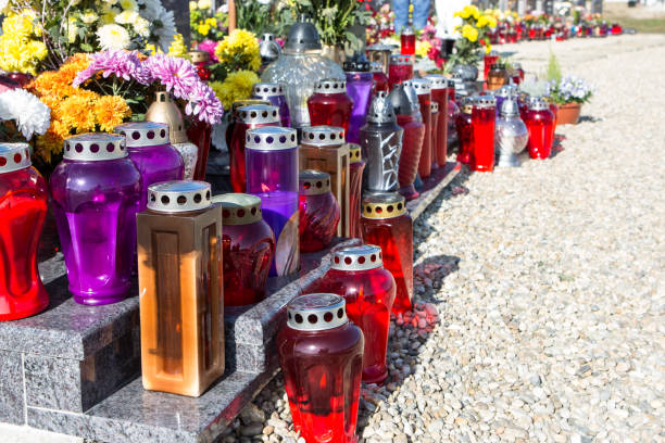 istock People remembering their loved ones who died; on the cemetery 1187208374