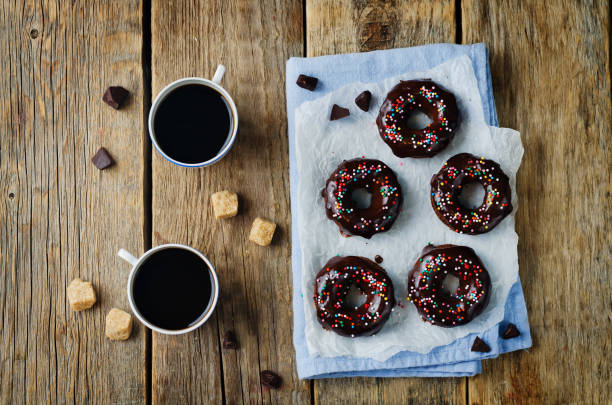 istock Baked chocolate doughnuts with chocolate glaze and coffee drink 1187210986
