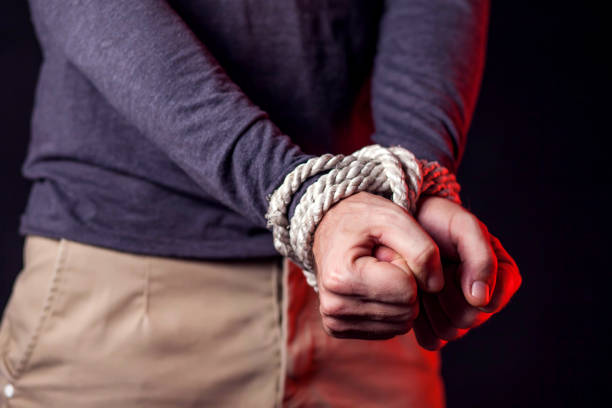 istock Man with bound hands. People violence and criminal concept 1187212464