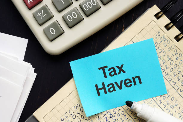 istock Text sign showing hand written words Tax Haven 1187212639
