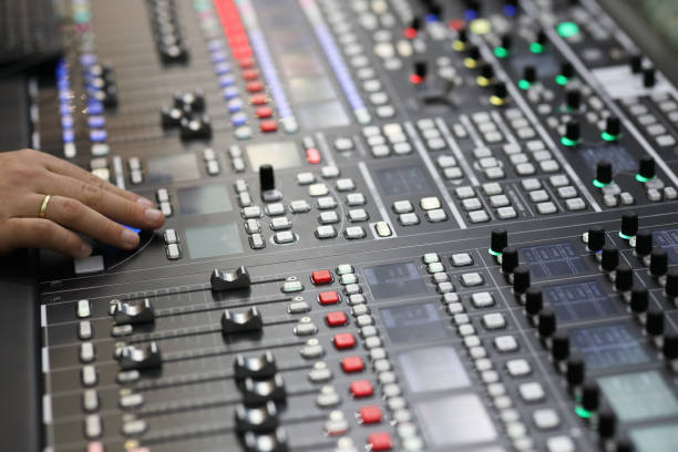 closeup view of the broadcast audio mixing console - human finger sound mixer music producer imagens e fotografias de stock