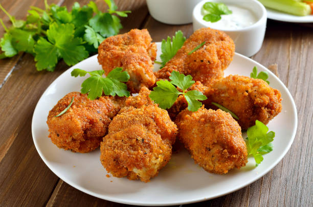 istock Grilled chicken wings, sauce and fresh parsley 1187215845