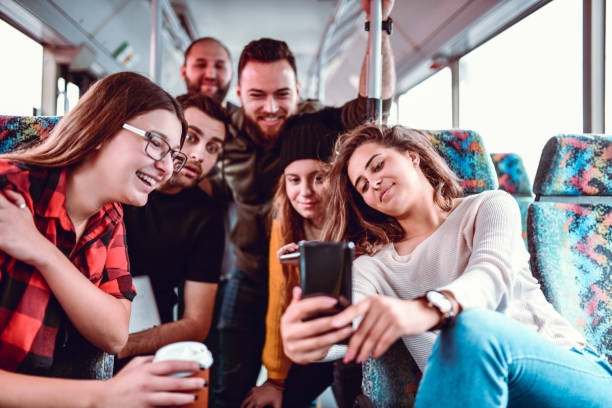 istock A Group Of Friends Taking A Bus Selfie 1187215953