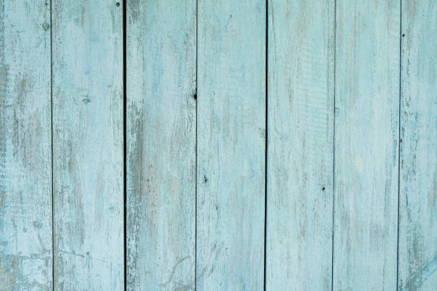 istock old wooden fence light blue paint peeling board texture. Background 1187216004