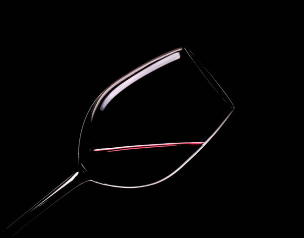 Elegant glass of red wine on a black background stock photo