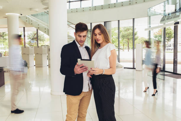 istock Young business couple working on tablet. Motion blur. 1187219830