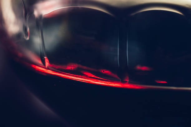Red wine bottles and glass.