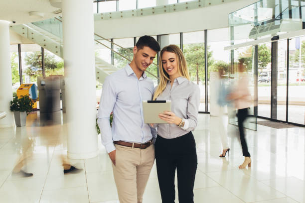 istock Young business couple working on tablet. Motion blur. 1187220664