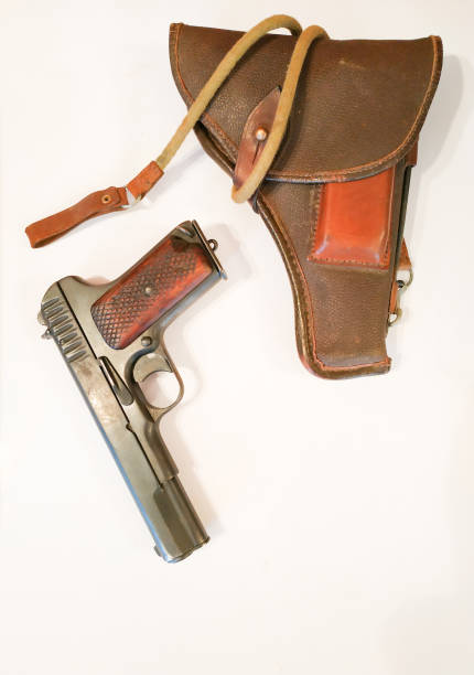 istock retro pistol on the table near skin case 1187221233