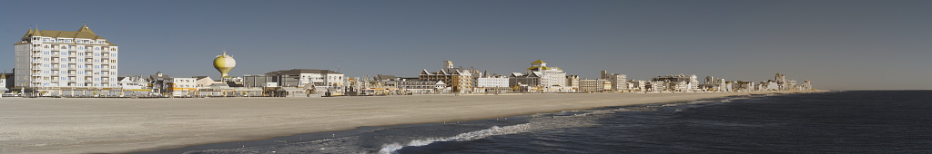 The beach in ocean city, maryland on a bright autumn day with no tourist in sight, and the stores are all closed for the season