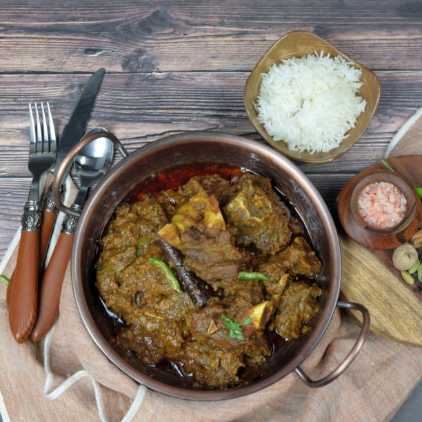 istock Overhead view of Goat curry, Mutton curry, Nihari, Rogan Josh in a bowl with  plain Rice. 1187225024