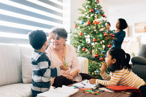 istock Children Making Christmas Decorations with Grandmother 1187226390