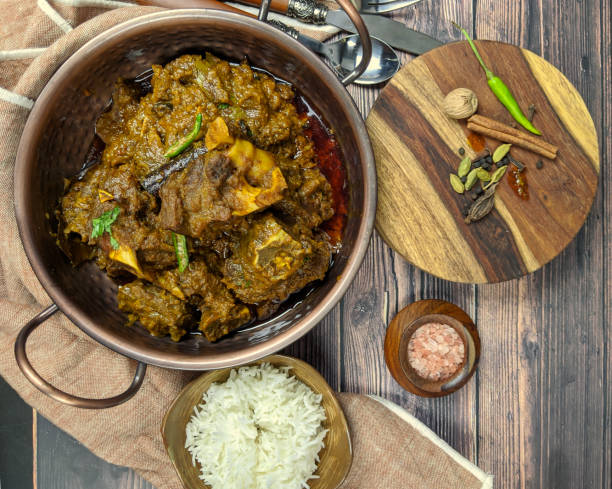 istock Overhead view of Goat curry, Mutton curry, Nihari, Rogan Josh in a bowl with Chapati and plain Rice. 1187226504
