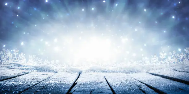 Wooden Plank Table With Sparkling Snow And Brilliant Explosion Background - Winter Display