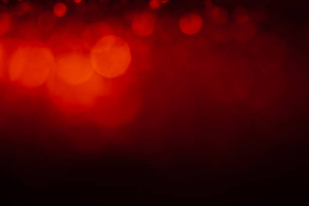 istock Red abstract background with bokeh defocused lights 1187230208