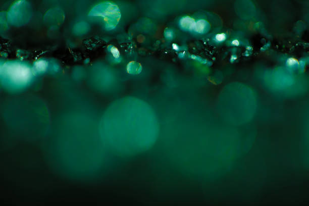 Monochrome abstract background with bokeh defocused lights Monochrome emerald abstract background with bokeh defocused lights. emerald green photos stock pictures, royalty-free photos & images