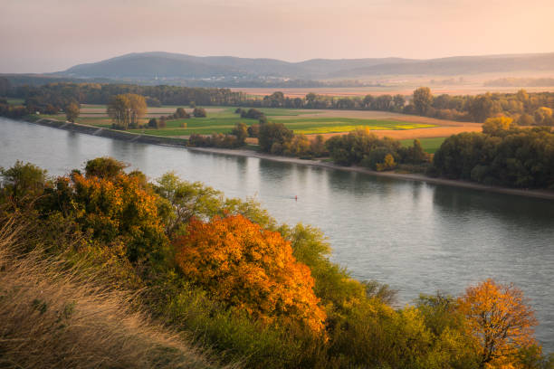 istock Autumn Landscape with River 1187234275