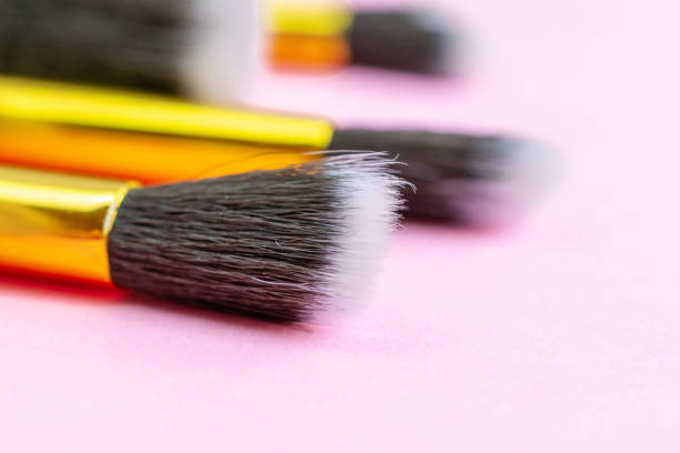 Make brush powder. Drawing cosmetic products isolated on pink background with copy space. Beauty glamour concept