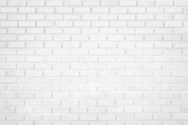 istock Wall white brick wall texture background in room at subway. Brickwork stonework interior, rock old clean concrete grid uneven abstract weathered bricks tile design, horizontal architecture wallpaper. 1187243403