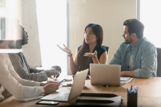 istock Annoyed diverse employees arguing at briefing, discussing contract terms 1187245865
