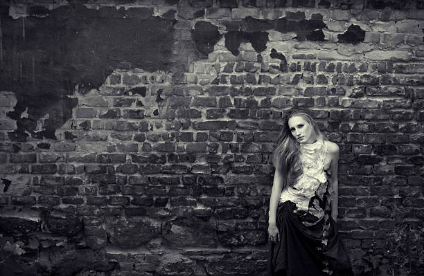 Woman silhouette in abandoned industrial building.