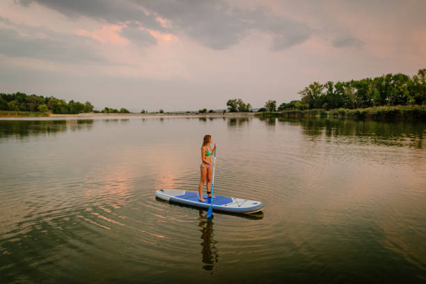 istock Stand up paddling on a lake 1187249145
