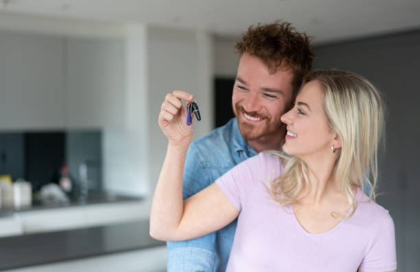 istock Loving couple buying a house 1187250907