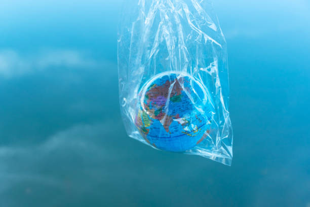 istock the earth model in a transparency plastic bag for environmental pollution planet protection concept with blue sky background 1187251703