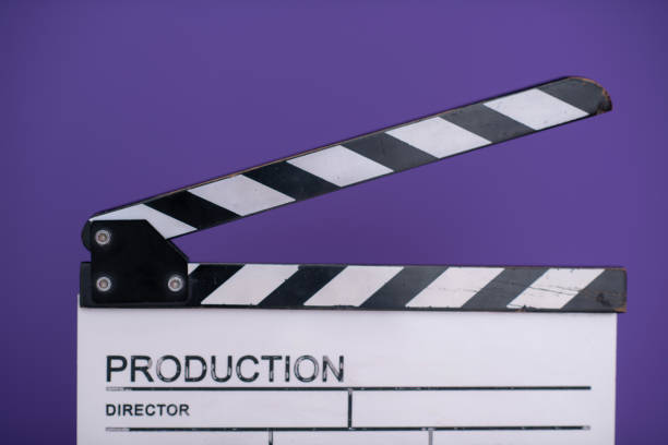istock movie clapper on purple background 1187251796
