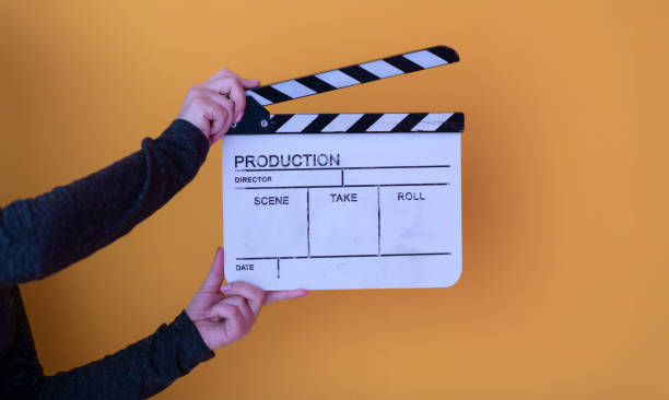 istock movie clapper on yellow background 1187251872