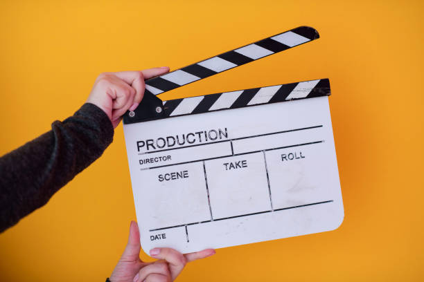 istock movie clapper on yellow background 1187251886