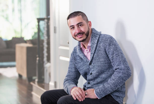 istock Mid adult Hispanic man at home 1187261508