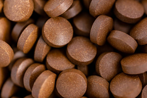 istock Brown iron supplement pills in the hands 1187262830