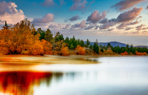 Beautiful autumn colors of Forest House  and lake reflection in Boraboy Lake and like wallpaper