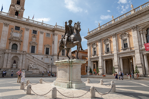 Rome, Italy - June 23, 2018: Panoramic view of Capitolium or Capitoline Hill is one of Seven Hills of Rome and Equestrian Statue of Marcus Aurelius is an ancient Roman statue on piazza del Campidoglio