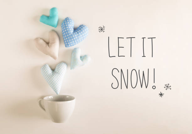 istock Let It Snow message with blue heart cushions 1187264846