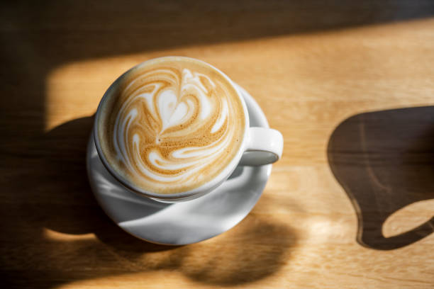 istock Cup of aromatic coffee with a pattern of hearts on a foam 1187264877