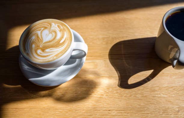istock Two cups of aromatic coffee with and without foam 1187265935