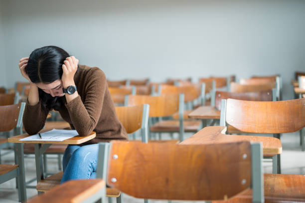 istock A female student sitting in a stressful classroom 1187268867