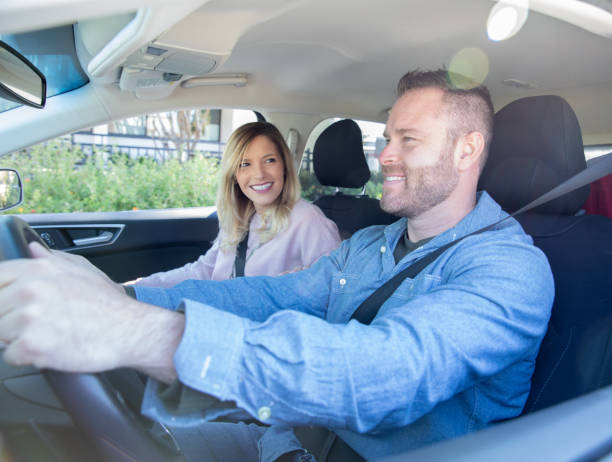 istock Happy couple going on date, using a car sharing service 1187278506
