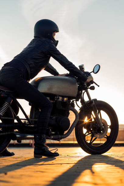 istock Biker girl on caferacer motorcycle. 1187279543