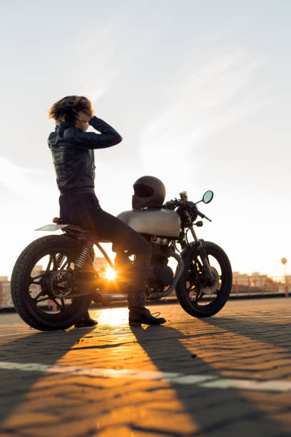 istock Biker girl on caferacer motorcycle. 1187279588